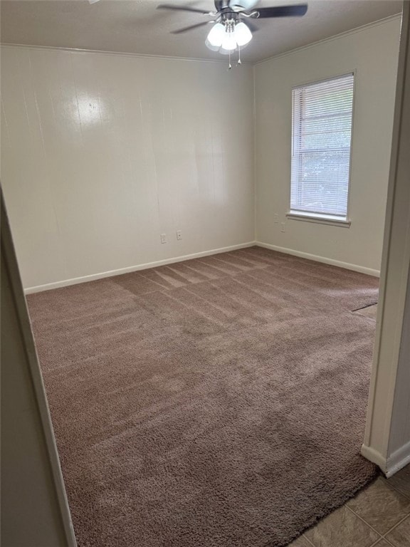 Unfurnished room with a ceiling fan, carpet floori