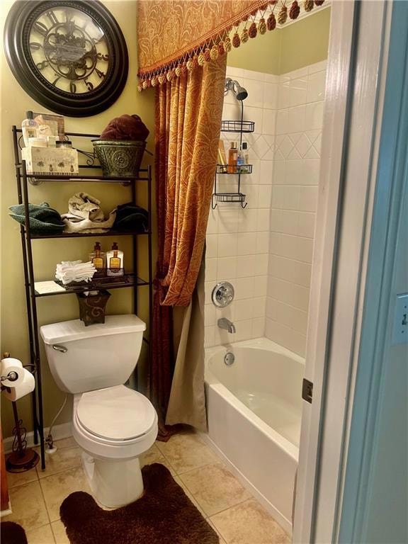 Full bath featuring tile patterned flooring, toile