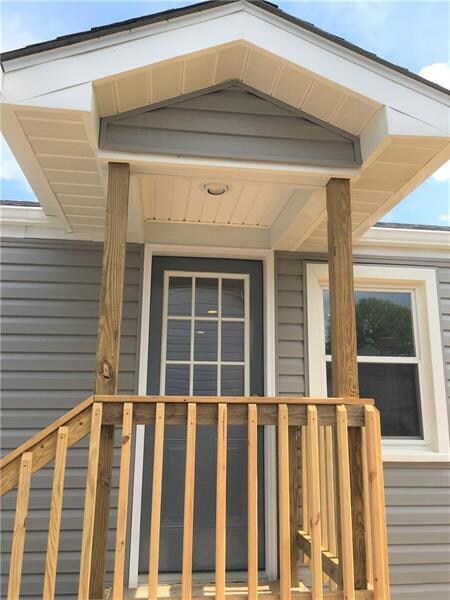 Brand new covered front door with light and new po