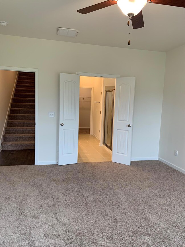 Double doors leading to the Owner's Suite bathroom.