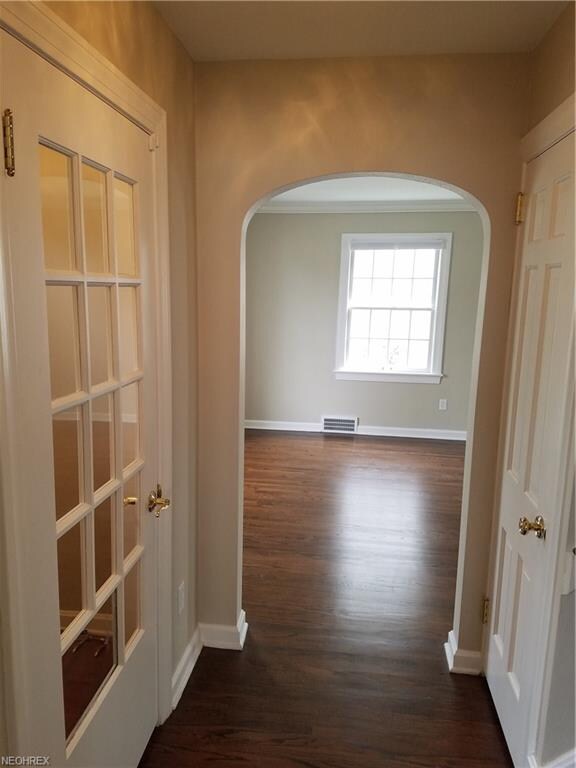 Hallway to living room, main entrance and second l