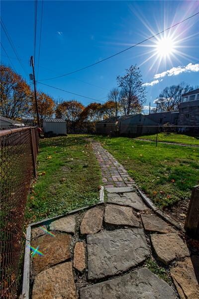 Nice sized fenced in backyard, with shed