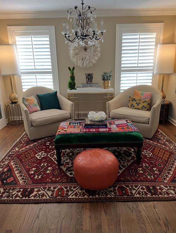 Living room with a chandelier, ornamental molding,