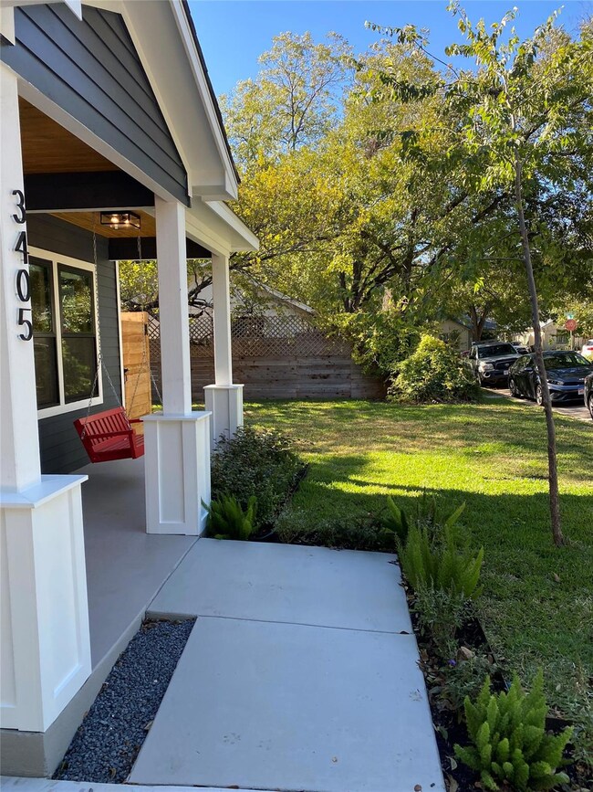 View of patio featuring fence and covered porch
