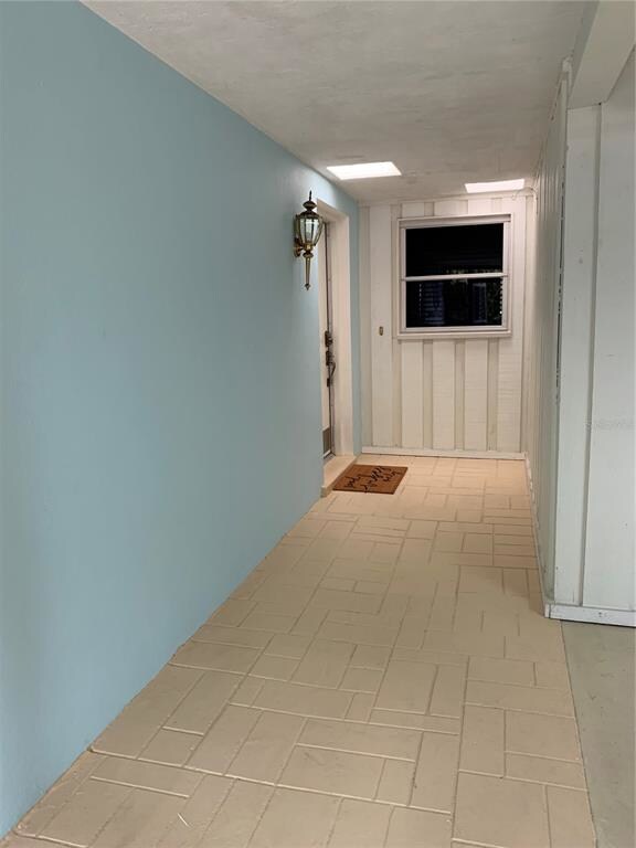 Walkway from locking front gate, garage on right, 