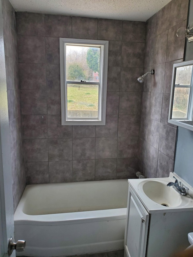 Bathroom featuring bathing tub / shower combinatio