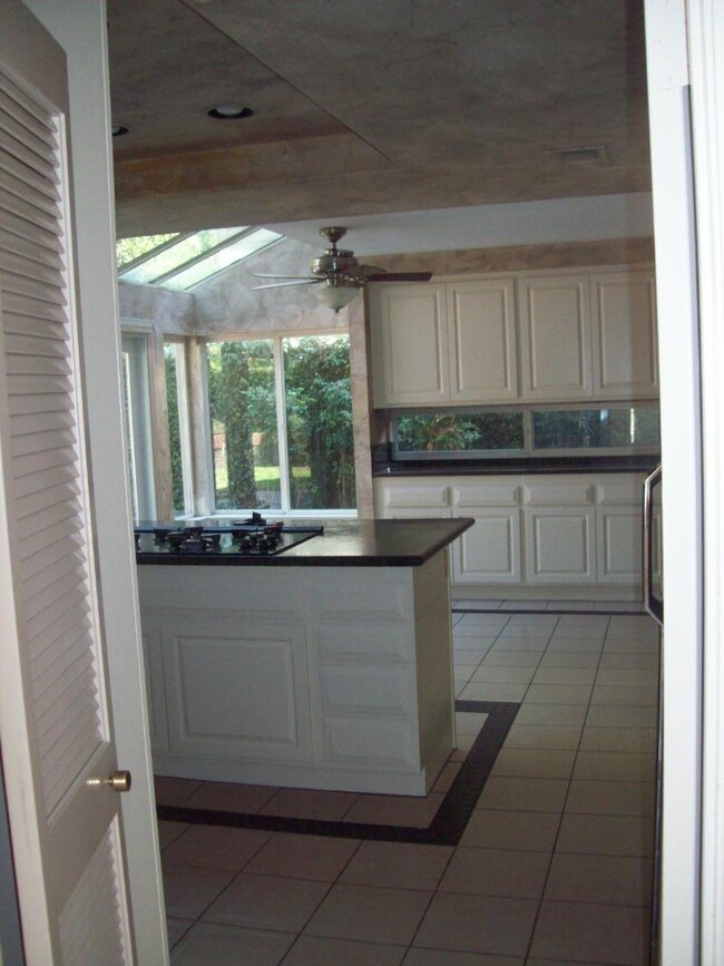 Sunny breakfast area off kitchen open to backyard