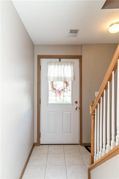 Entry with ceramic tile floor