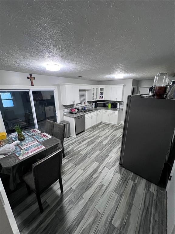 Kitchen featuring refrigerator, dishwasher, white 