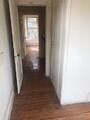 Corridor with dark hardwood / wood-style floors