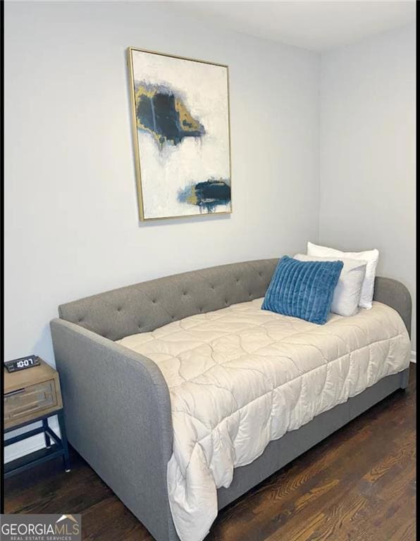 Bedroom with wood finished floors