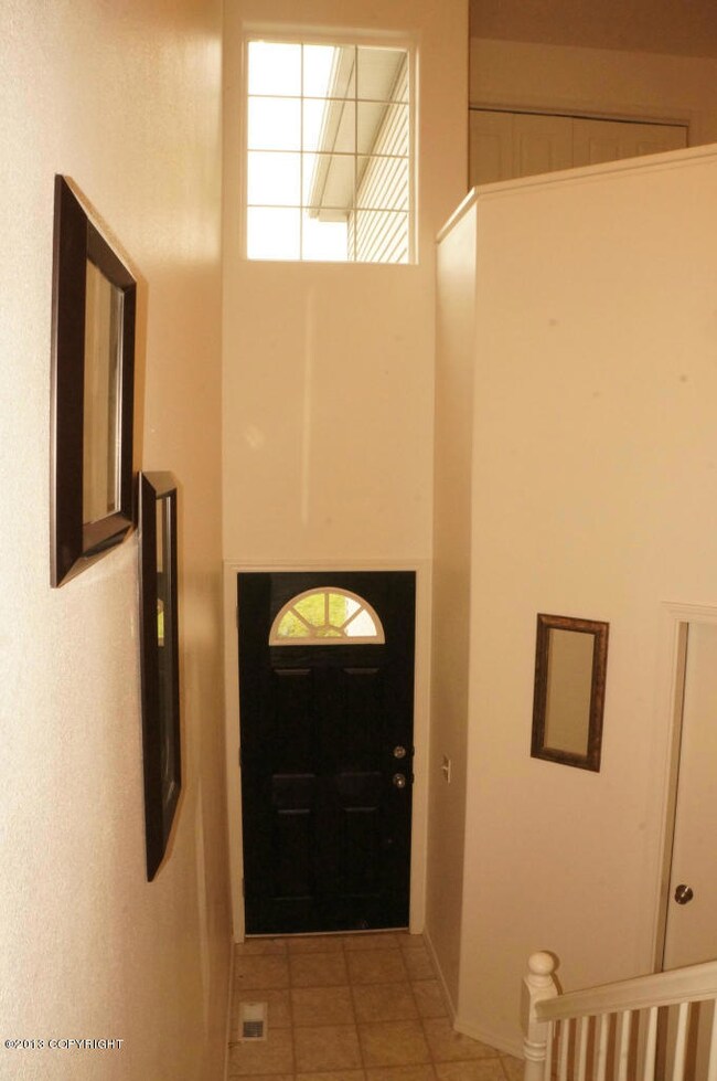 Entry With Two Story Ceiling