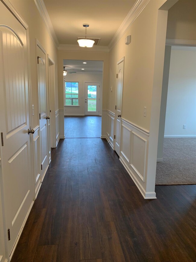 The wide hall ways have two piece crown molding, shadow boxes, and chair rails, giving your home a touch of elegance.