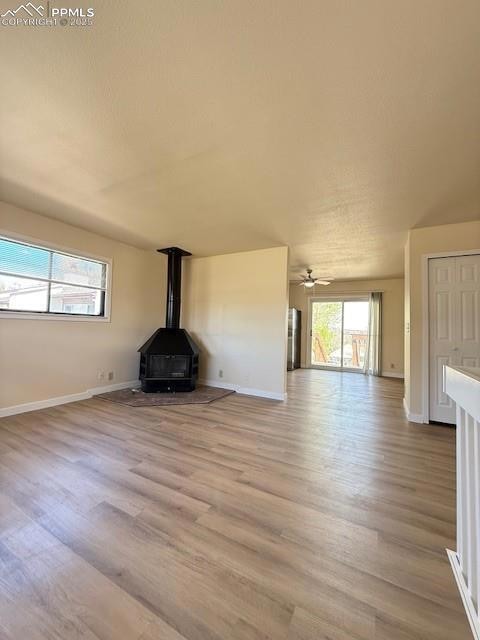 Unfurnished living room featuring a textured ceili
