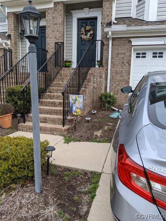 Property entrance with a garage