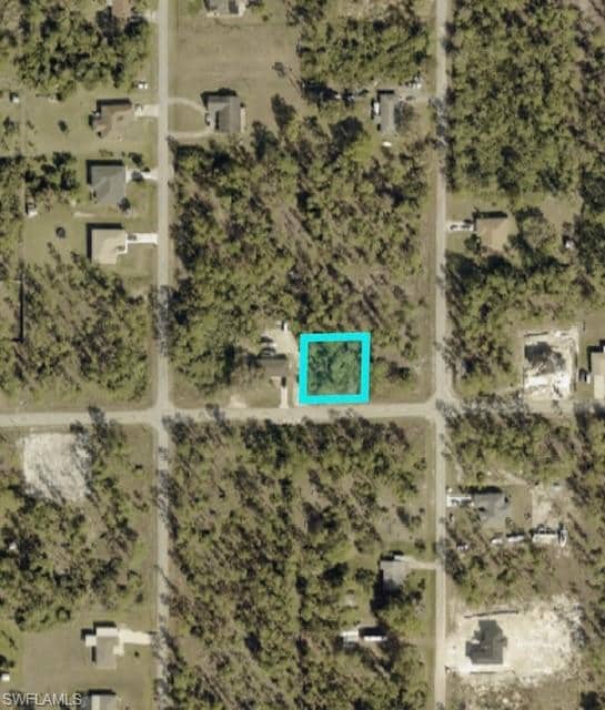 Aerial overview of property's location featuring property parcel outlined