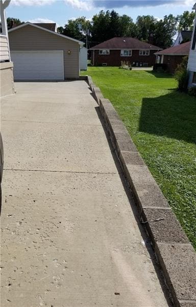 Retaining wall on side of cement driveway