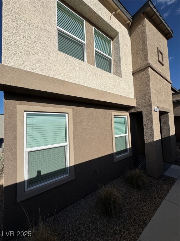 View of property exterior with stucco siding
