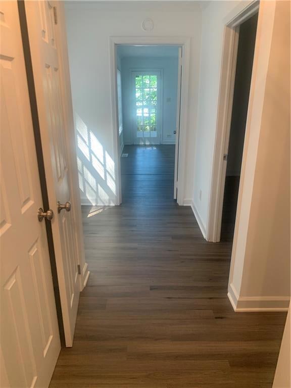 Hallway to left of front door leading to Master Bedroom and Second  Bedroom dark hardwood / wood-style flooring