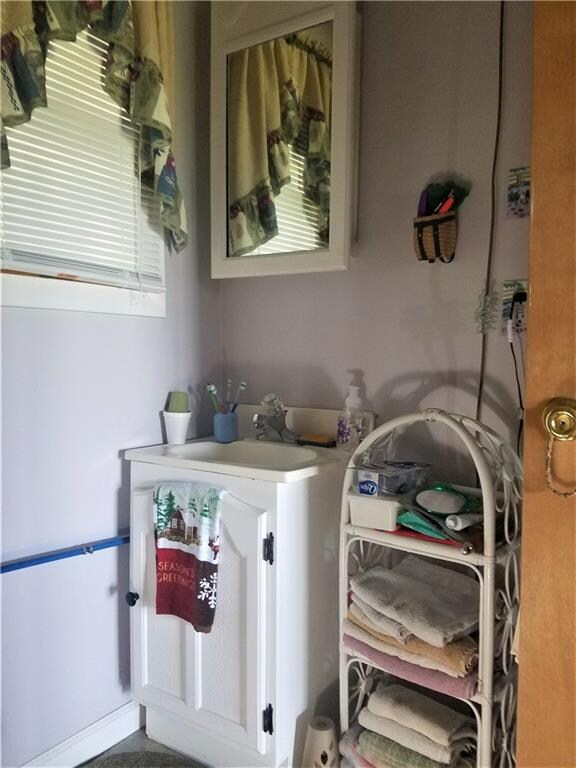 Bath vanity with running water from rain barrels