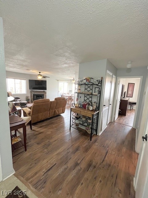 Hall featuring a textured ceiling and wood finishe