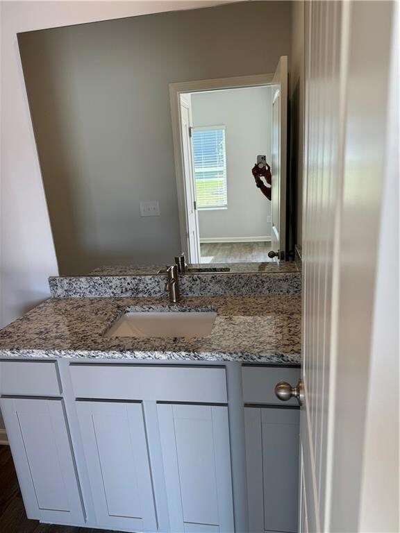 Bathroom featuring hardwood / wood-style floors an