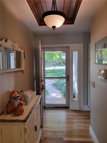 Front Entry with Storm Door and Accent Ceiling