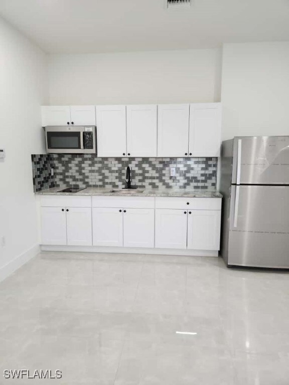 Kitchen with appliances with stainless steel finis