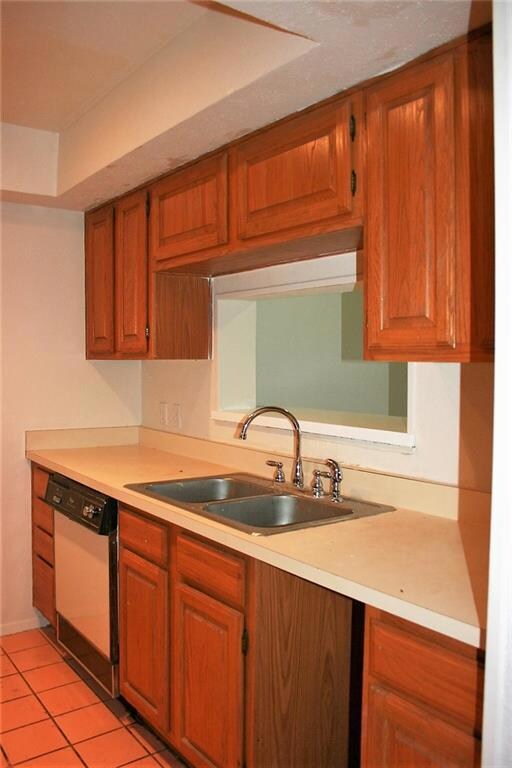 Galley kitchen with pass through window to dining 