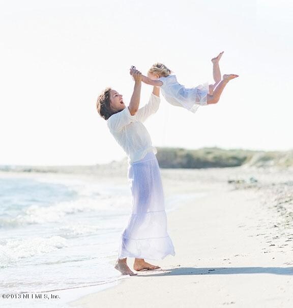 Mom & Child Swinging on the Beach