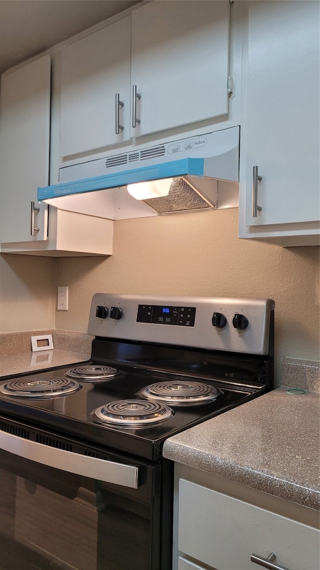 Partial view of remodeled kitchen and new stove