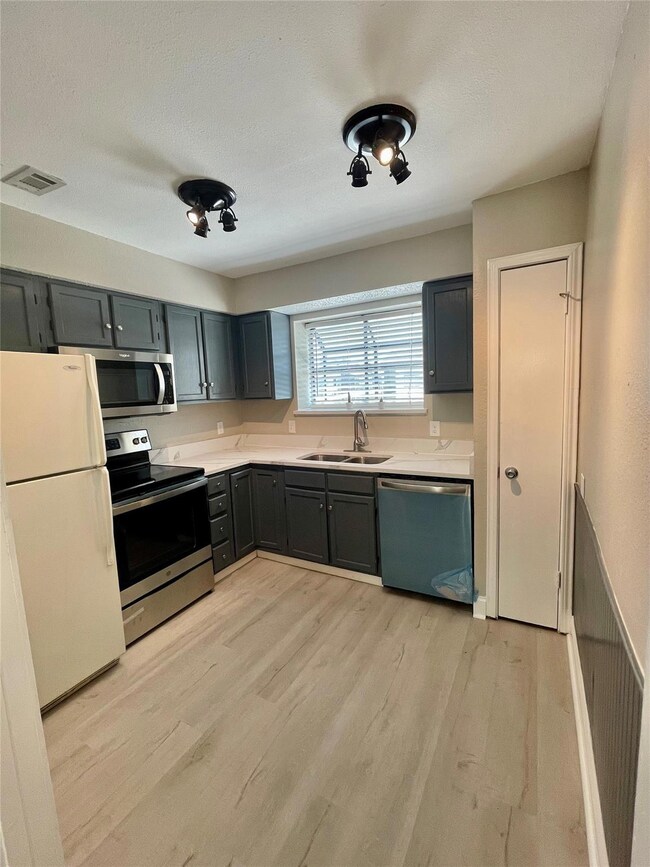 Kitchen featuring light hardwood / wood-style floo