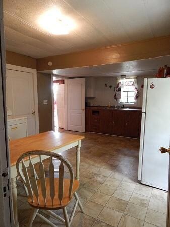 Kitchen is located where it can be accessed from the living area and den area.  