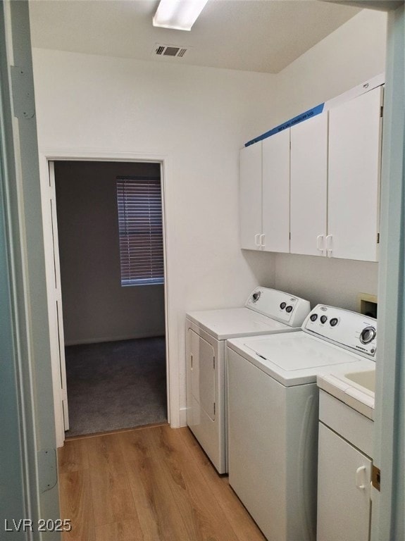 Laundry room featuring cabinet space, independent