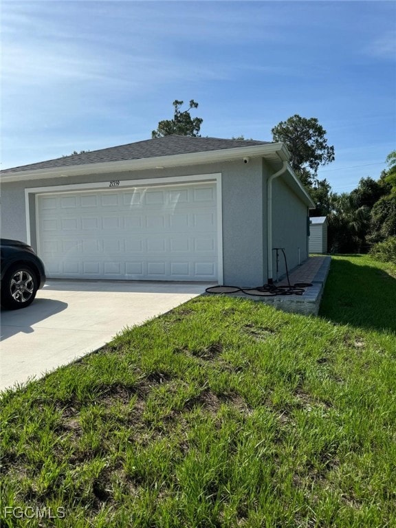 Garage featuring driveway