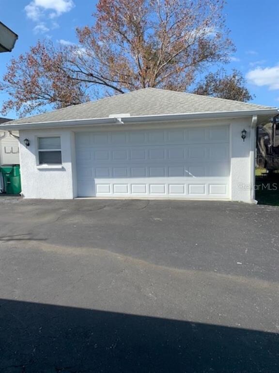 2 car garage, insulated, sheetrock walls, in back 
