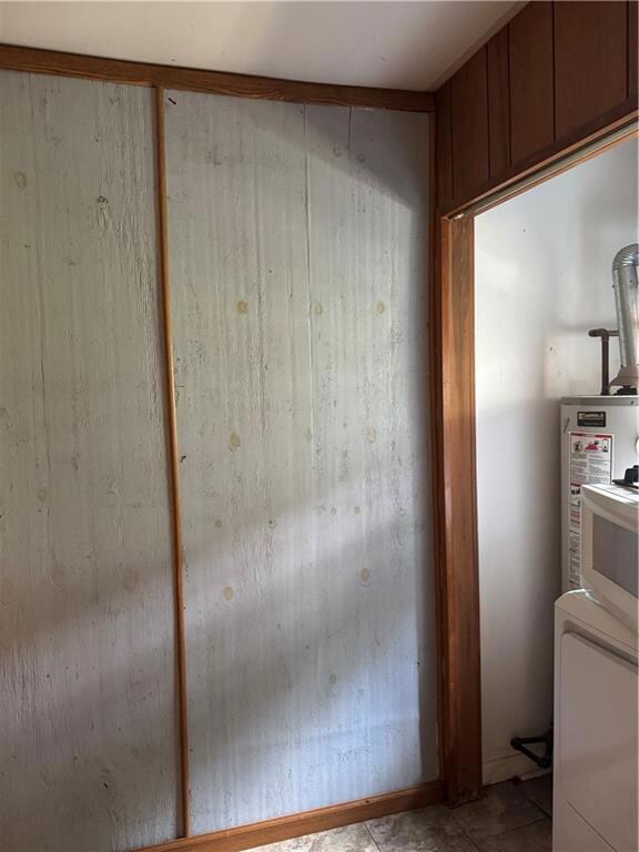 Laundry room has full sized washer and dryer.