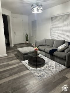 Living room with wood finished floors and baseboards
