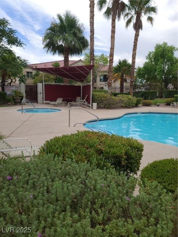 Community pool with a patio area