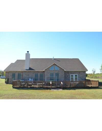 Exterior Back. Sellers added this deck and just lo