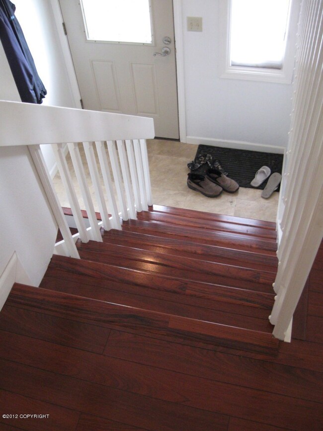 New tile entry & wooden stairs
