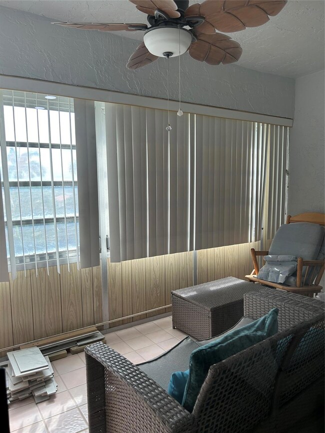 ENCLOSED BALCONY OFF LIVING RM & MAIN BEDROOM