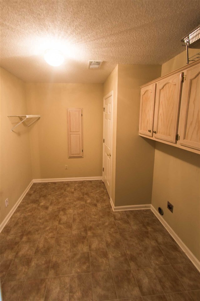 This large laundry room has plenty of space. It al