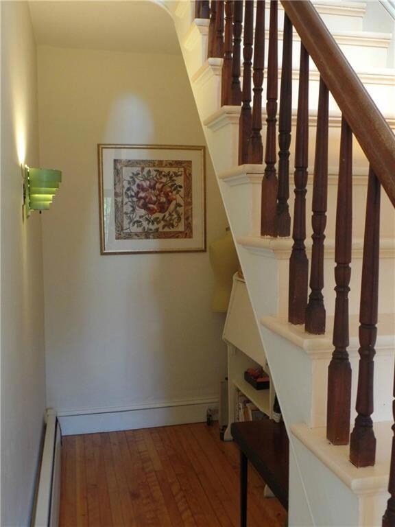 Tucked under the main stairway, a...