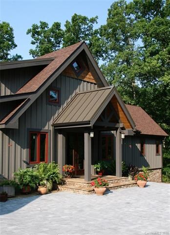 Gracious entrance includes pavers, custom stone wo