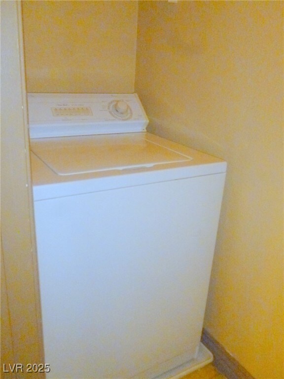 Laundry area featuring laundry area and washer / c