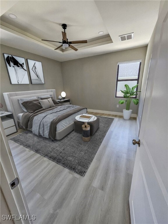 Bedroom featuring light hardwood / wood-style floo