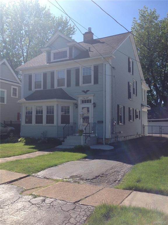Driveway that leads to garage and parking area