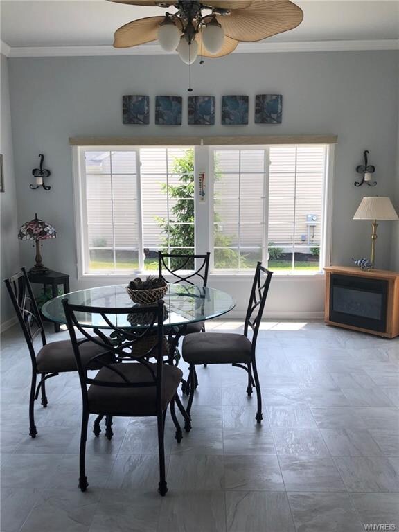 Beautiful light and bright sunroom off of kitchen
