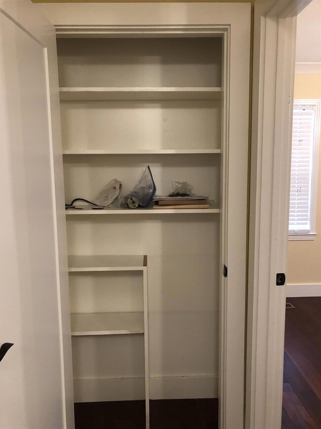 Large linen closet at the end of the hall